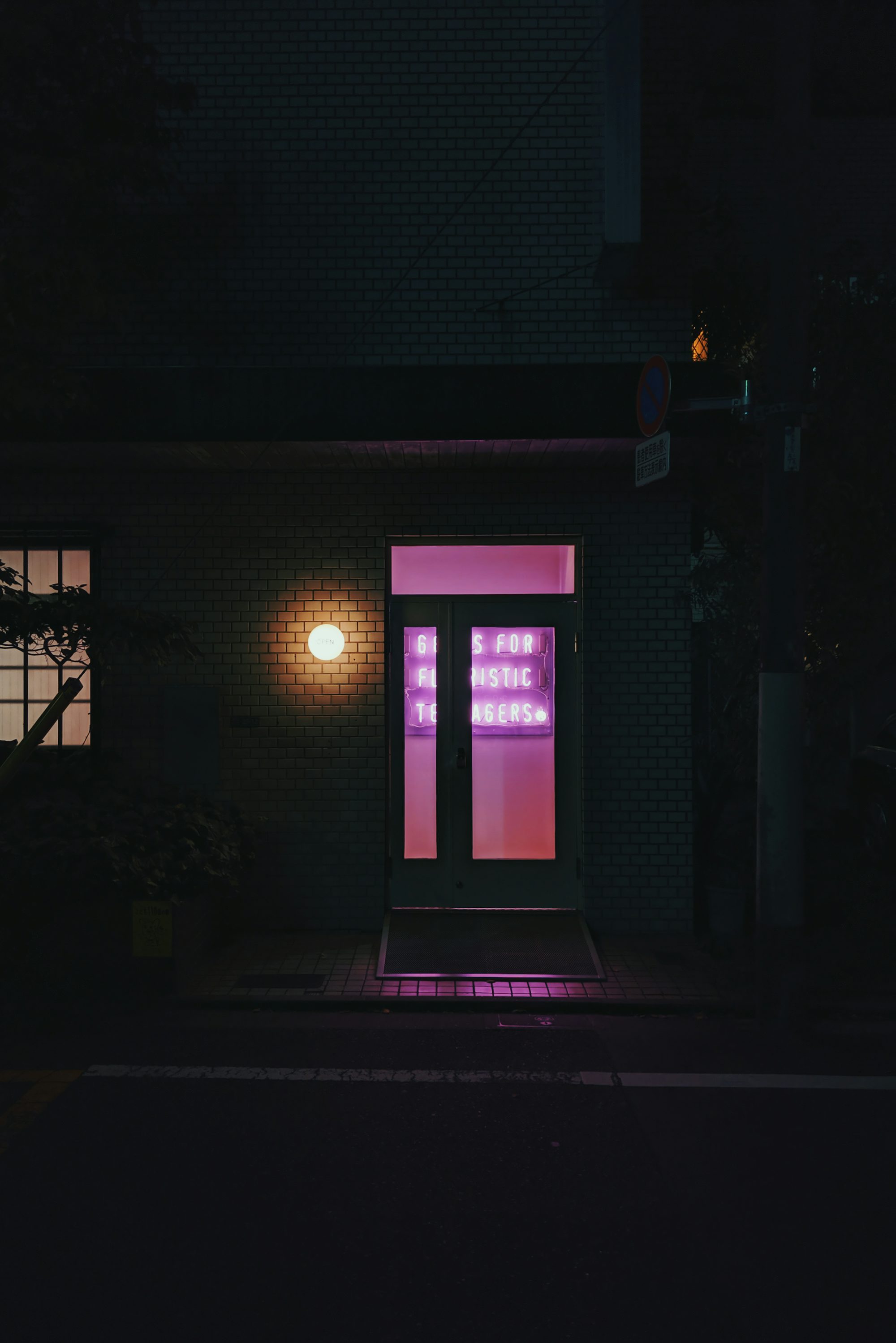 lighted orange outdoor lamp during night time