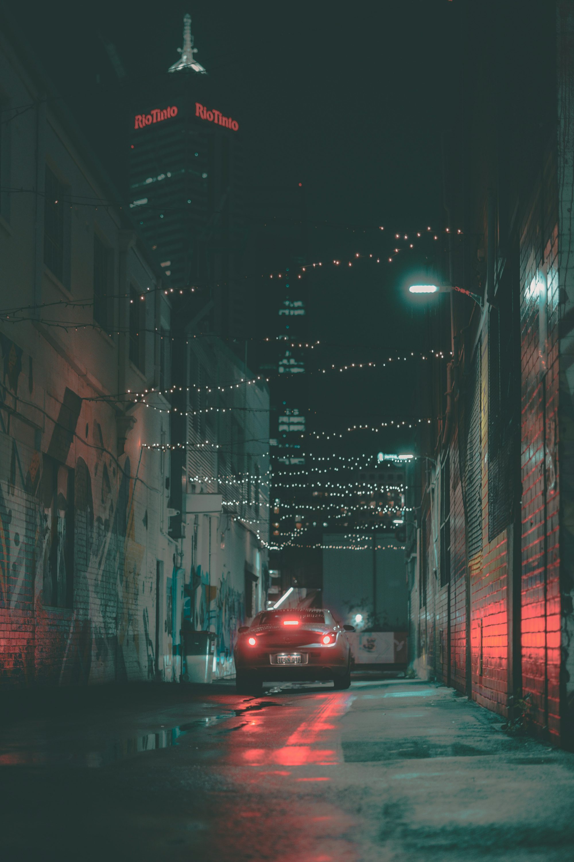 red car on road during night time
