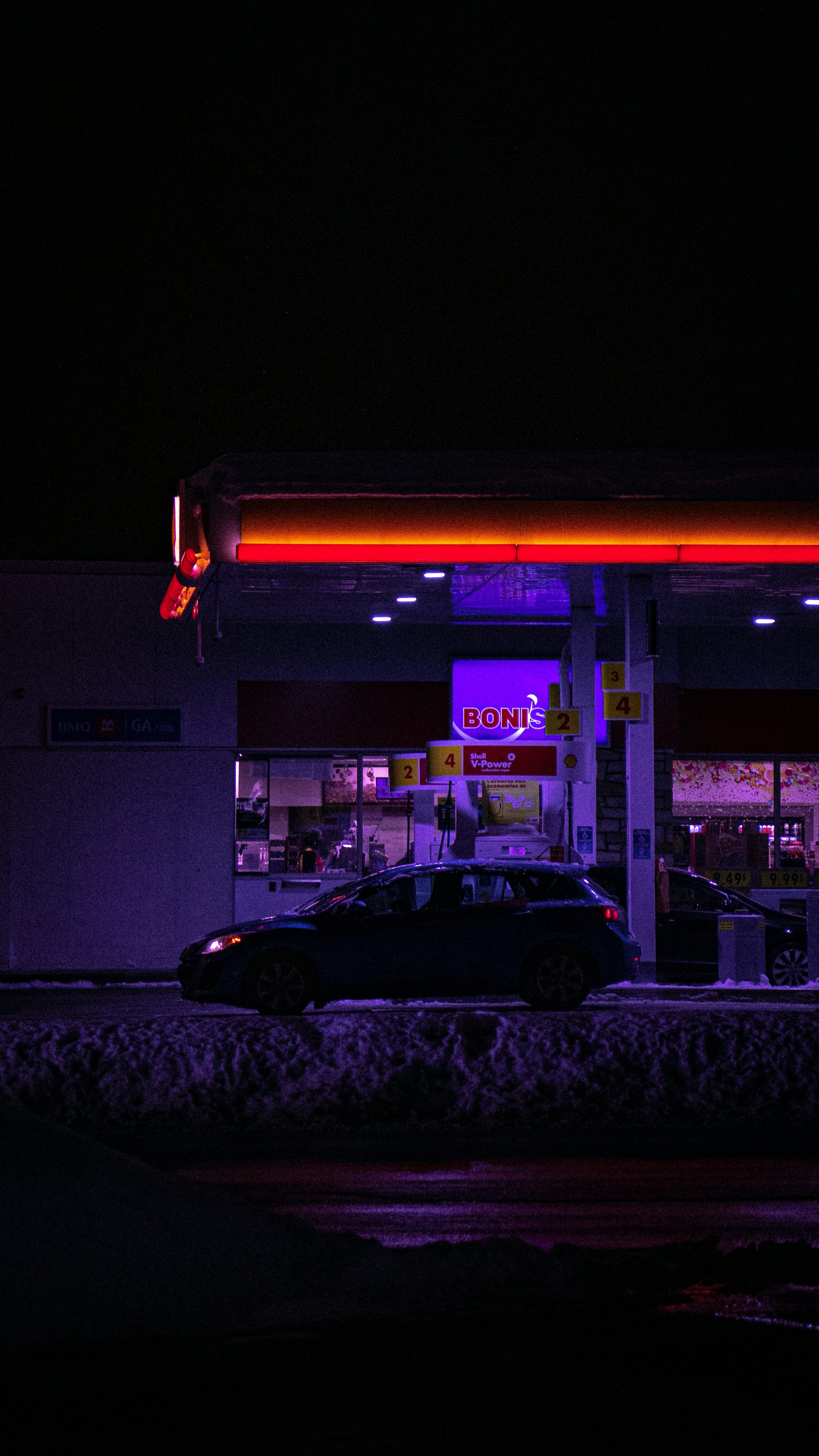 black car parked in front of store