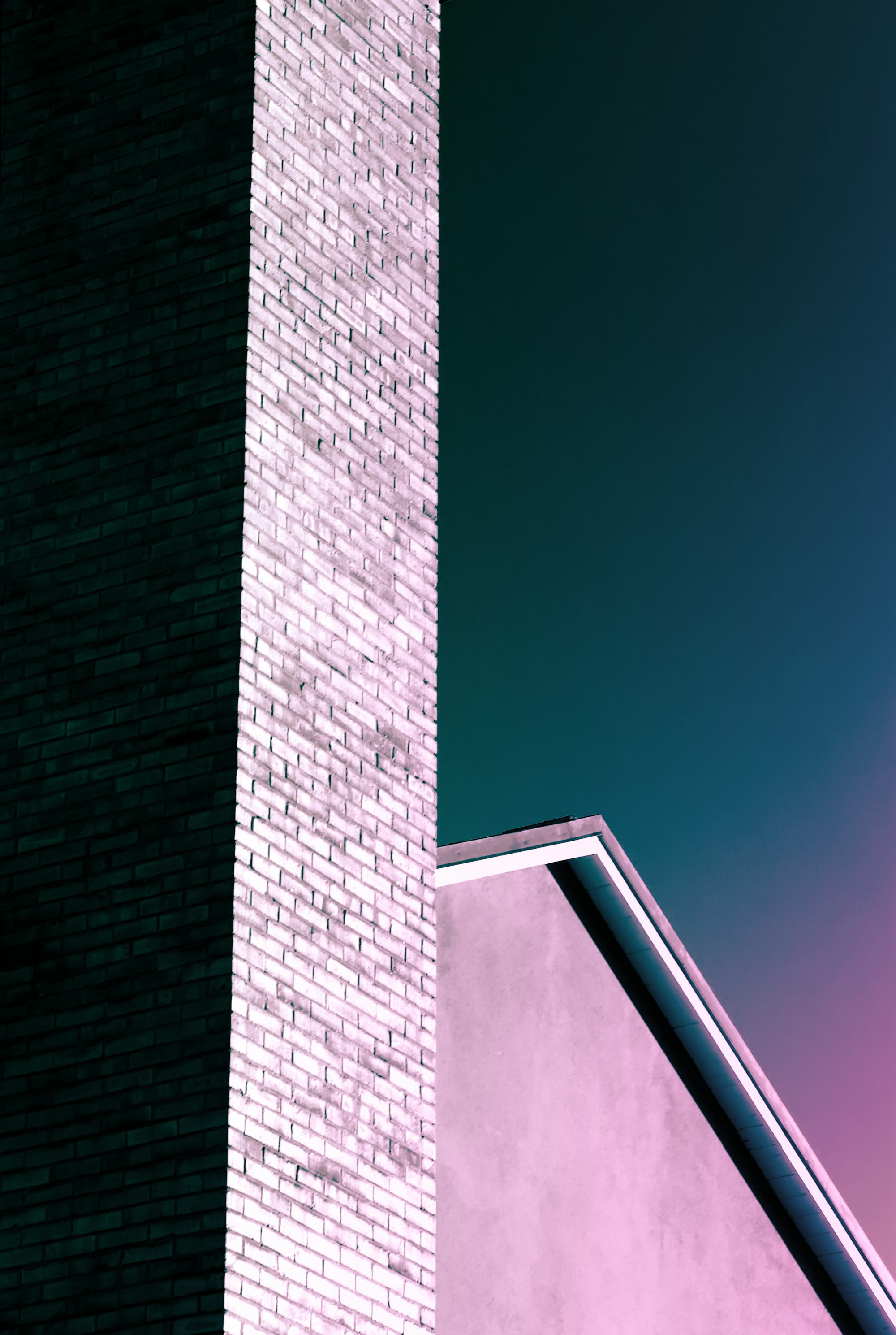 brown brick wall under blue sky during daytime