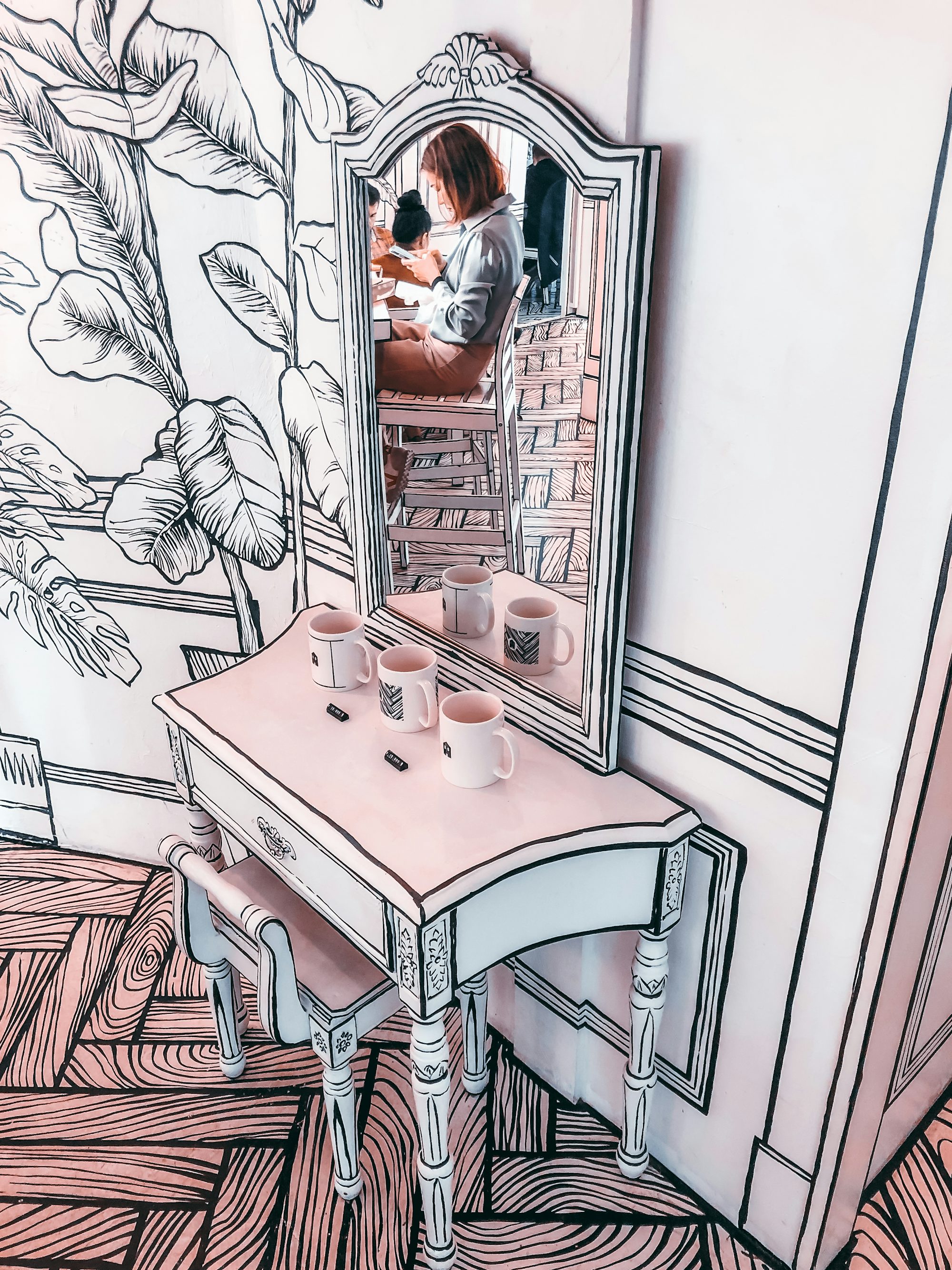 white wooden table with 2 chairs