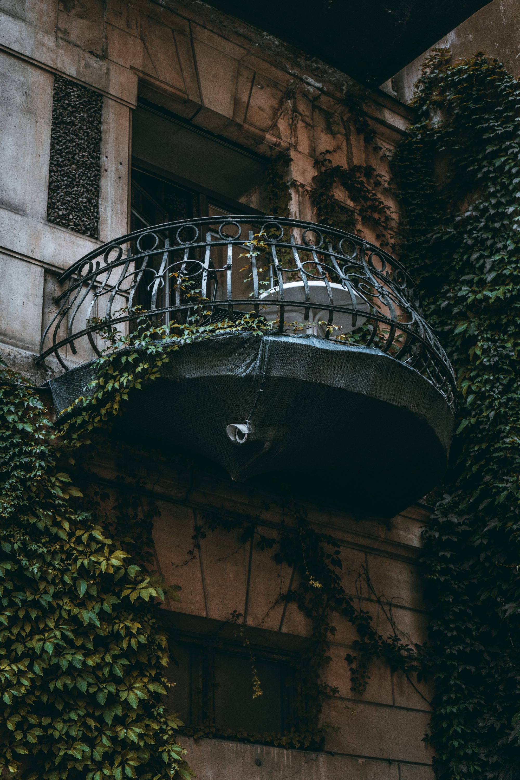 black metal spiral staircase on brown concrete building