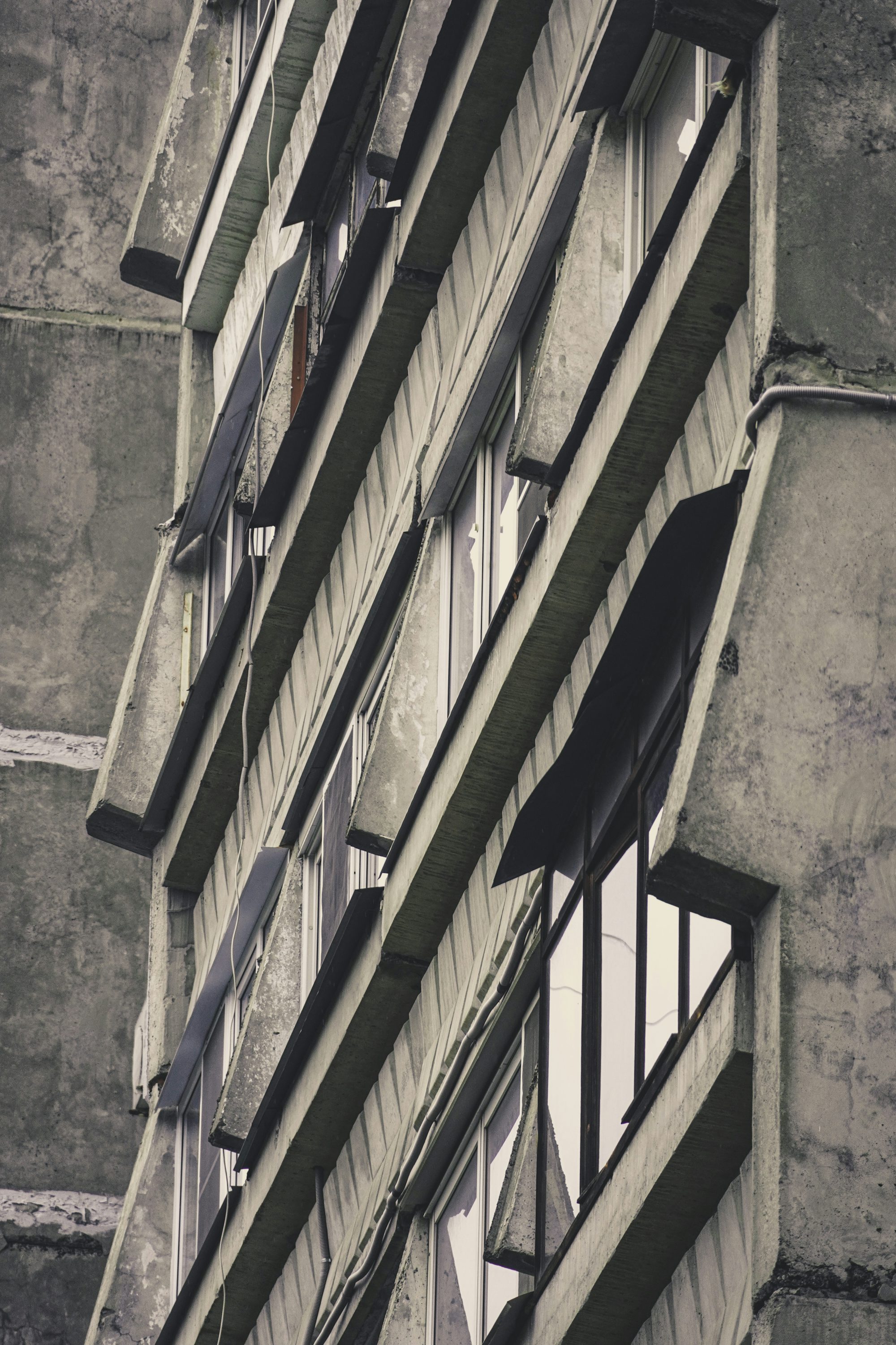 a tall building with lots of windows next to it