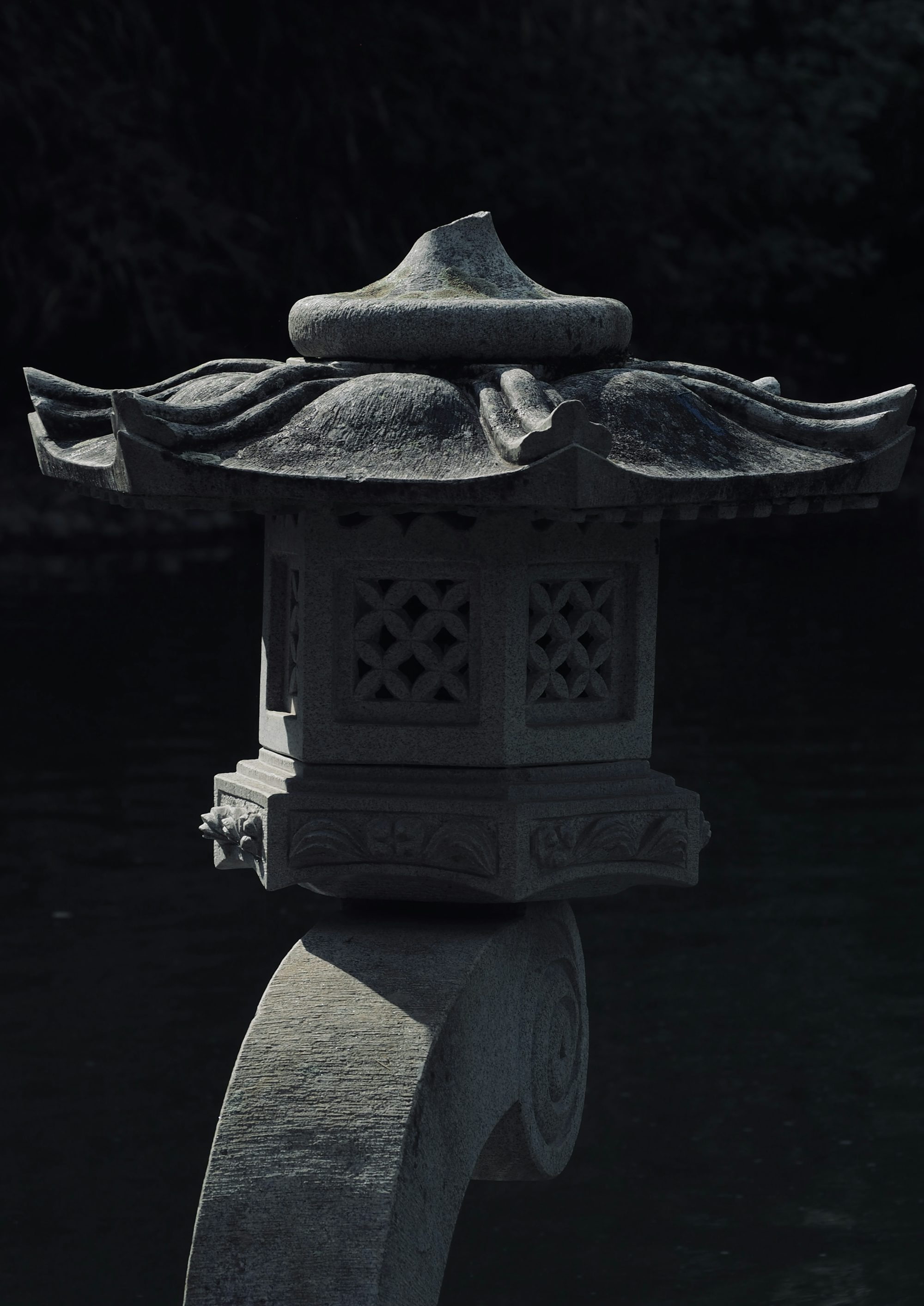 a black and white photo of an oriental lantern