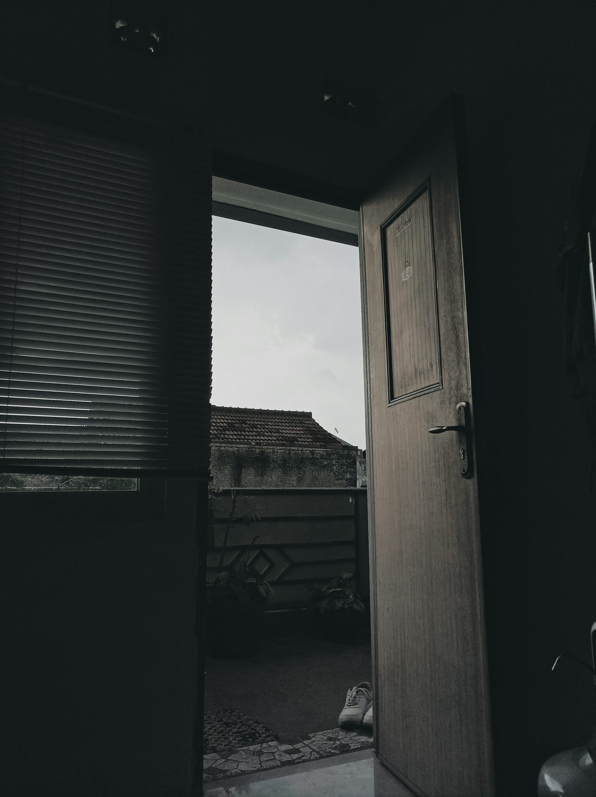 an open door leading to a dark room