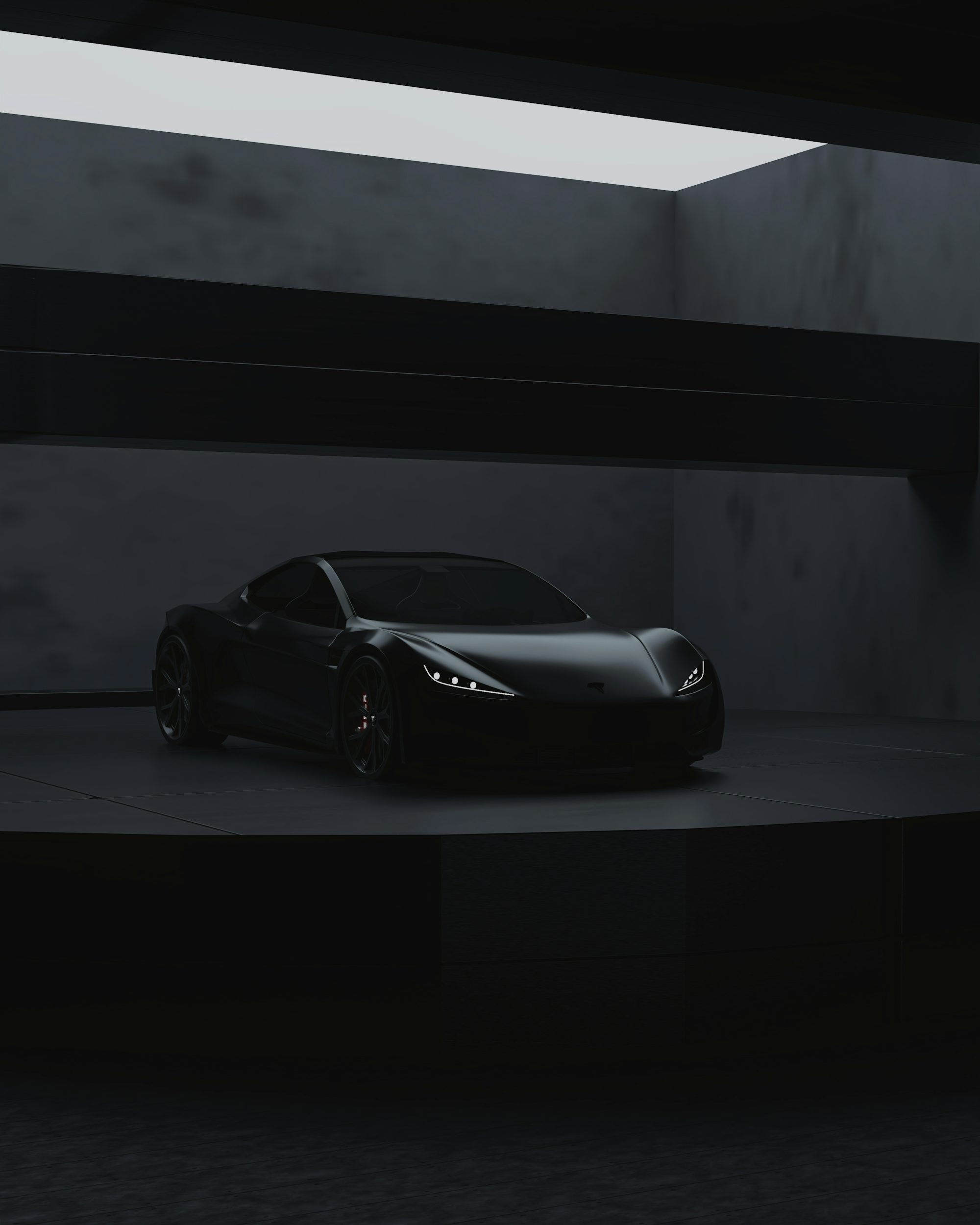 a black sports car in a dark room