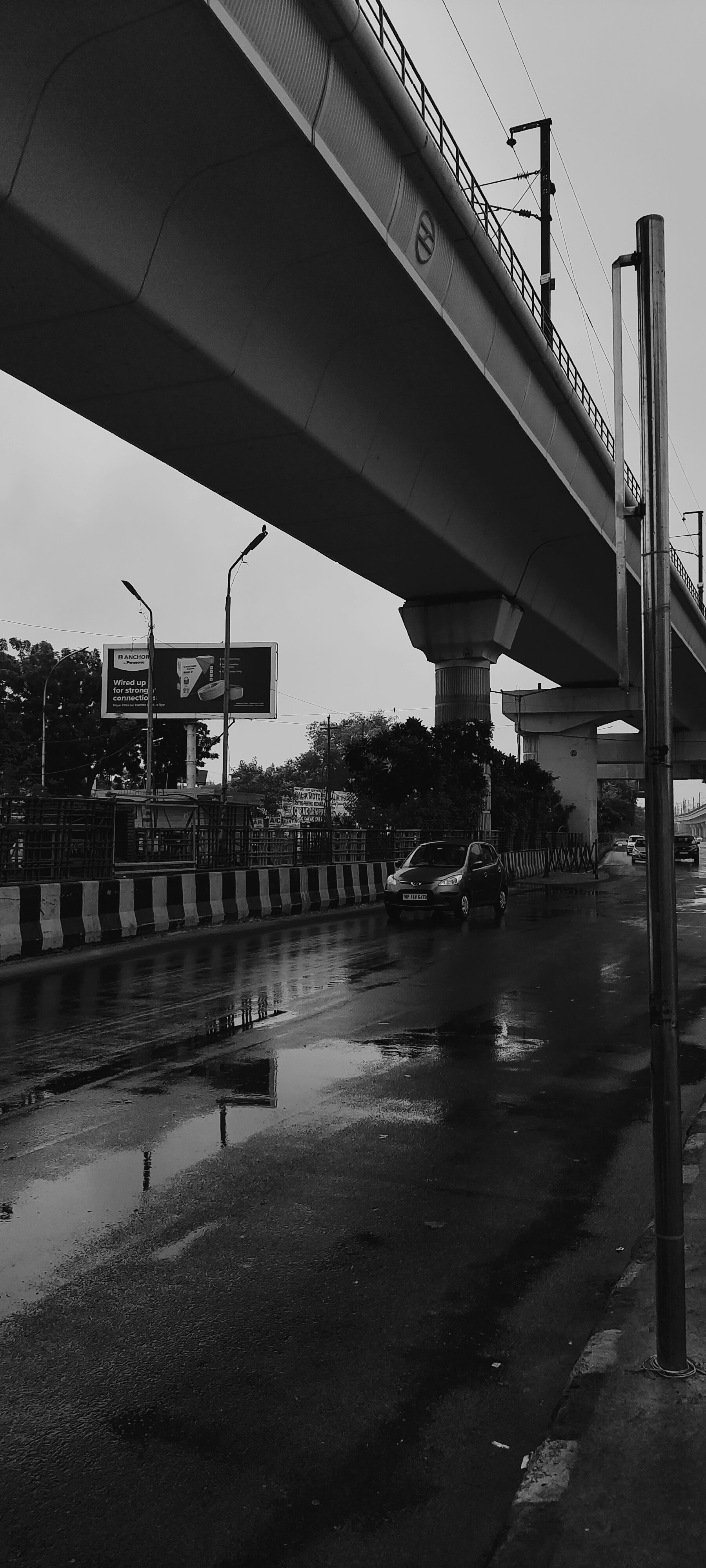 a car driving under a bridge
