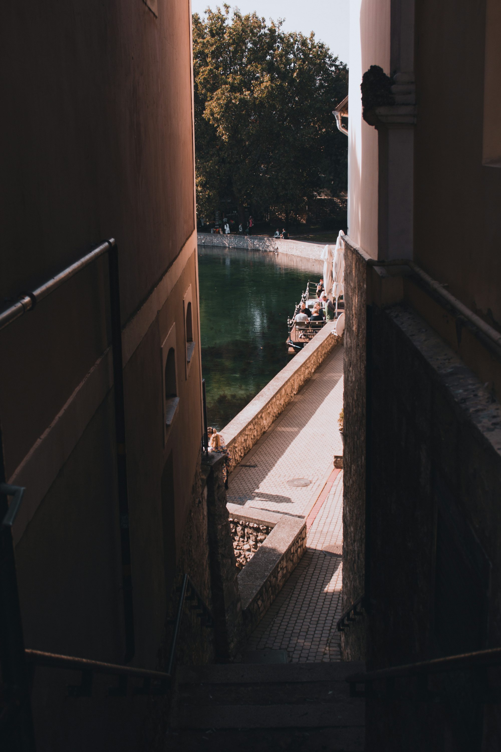 a group of people on a boat in a canal