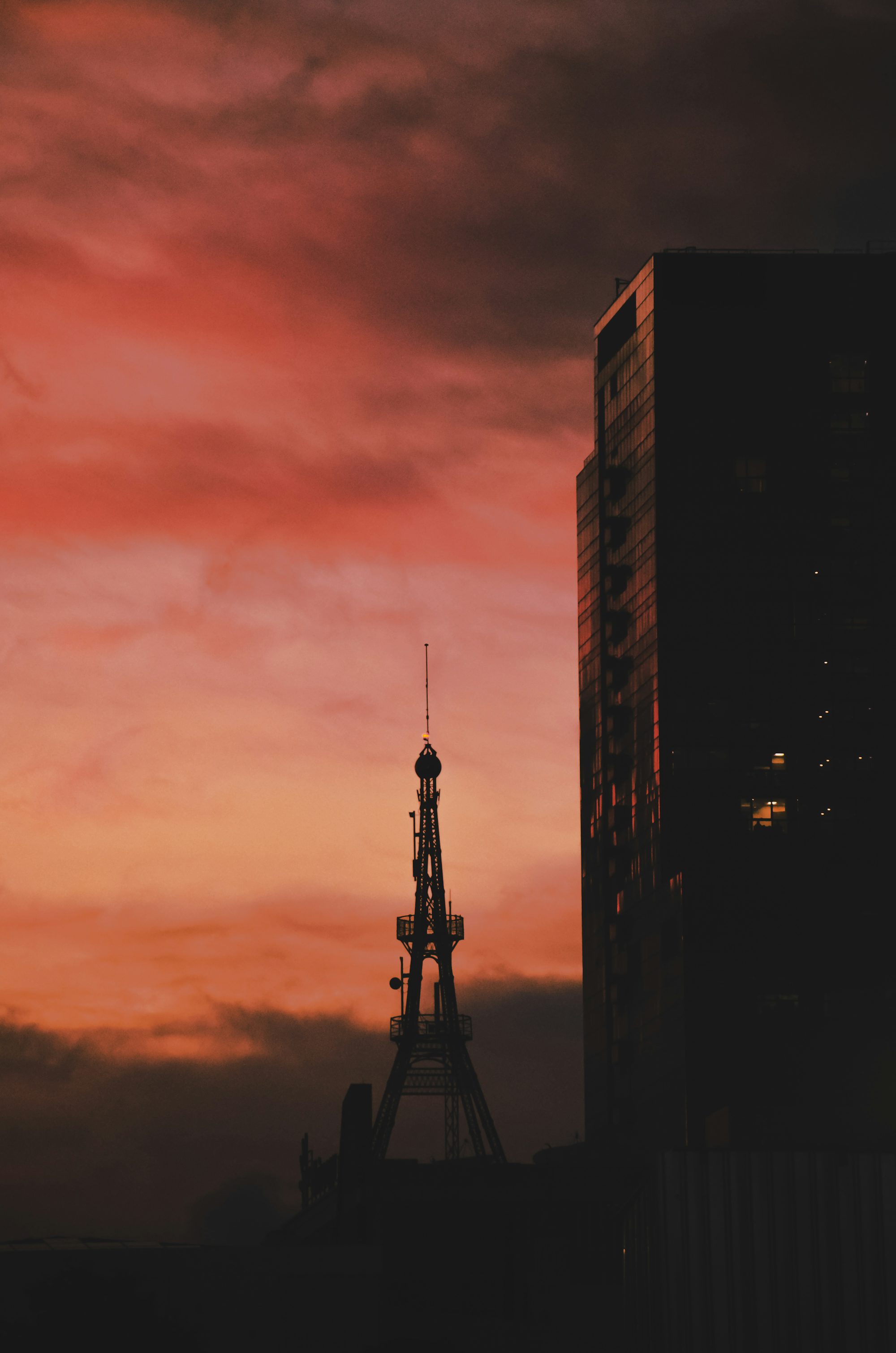 a tall tower with a cloudy sky