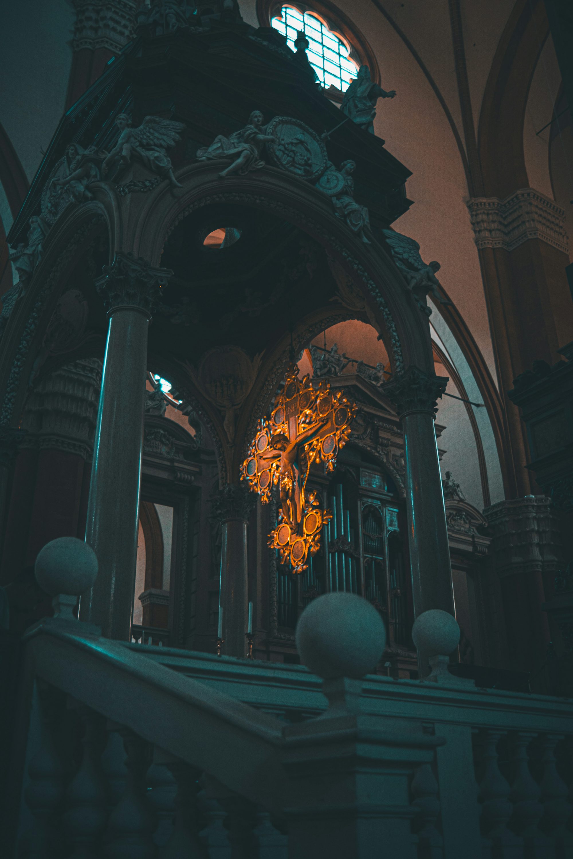 a church with a large chandelier hanging from the ceiling