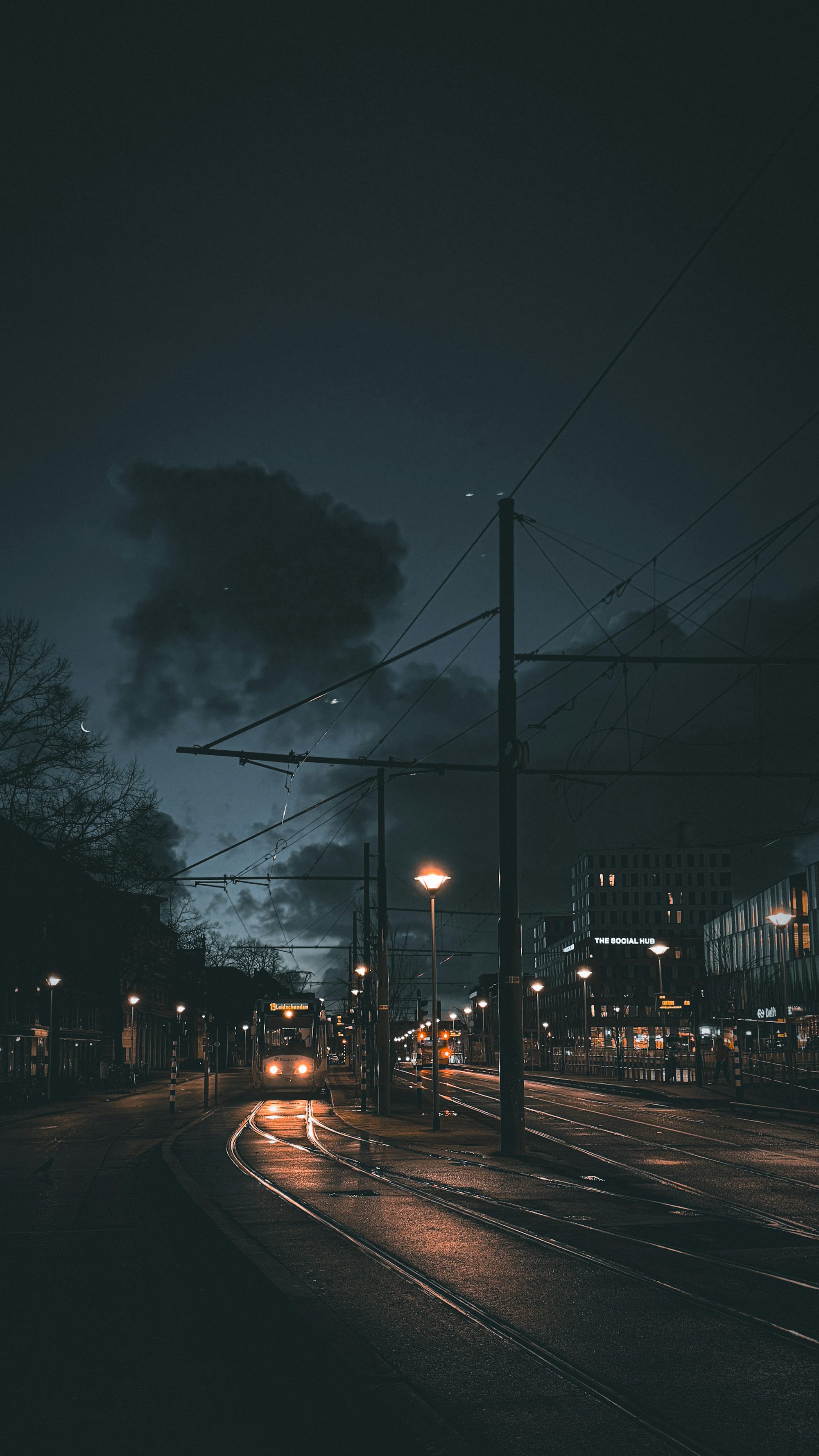 A city street at night with street lights