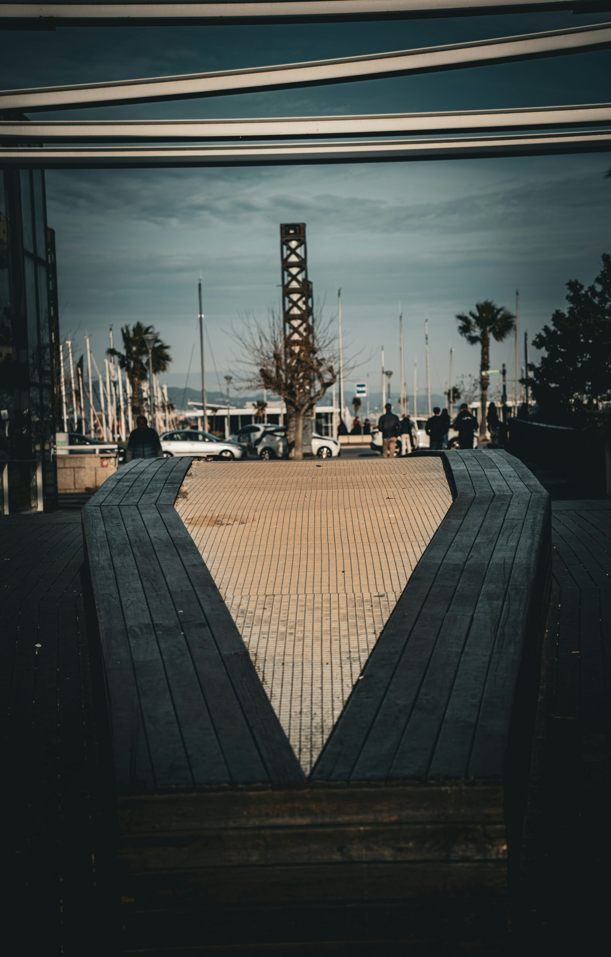 A view of a dock with boats in the background